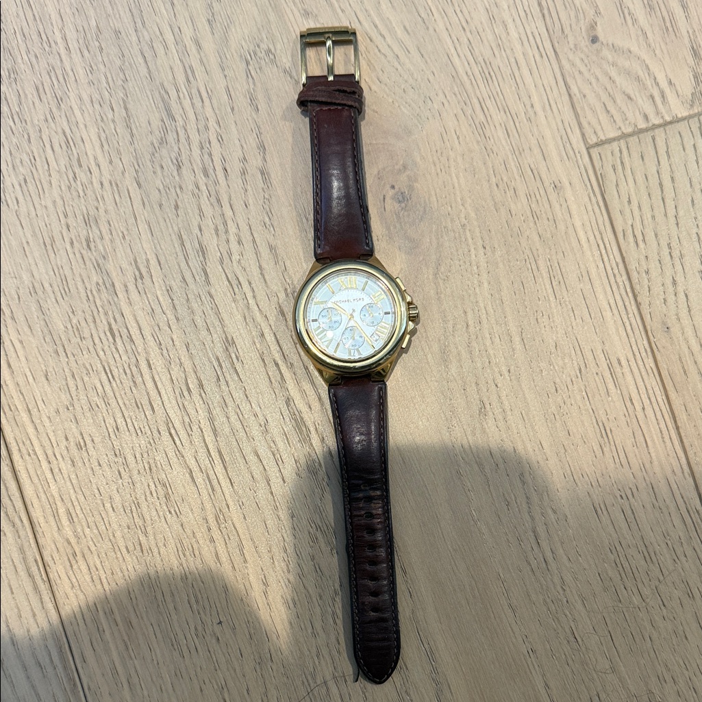 Gold And Brown Watch 15$